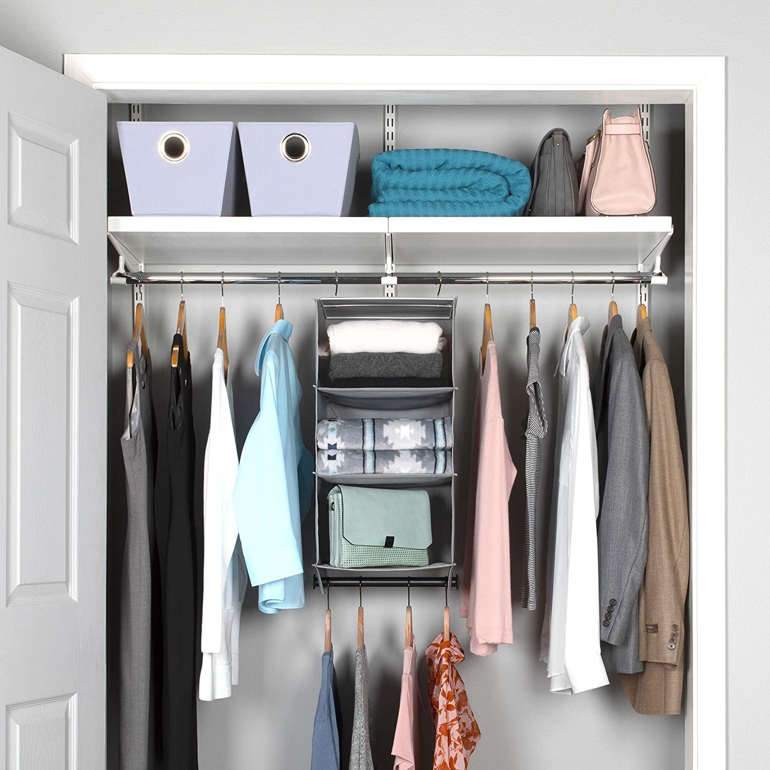 A hanging closet organizer with a garment rod that can store clothes, scarves, and handbags simultaneously