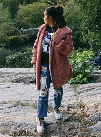 reviewer wearing the pink coat