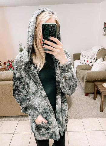 reviewer wearing the tie dye cardigan