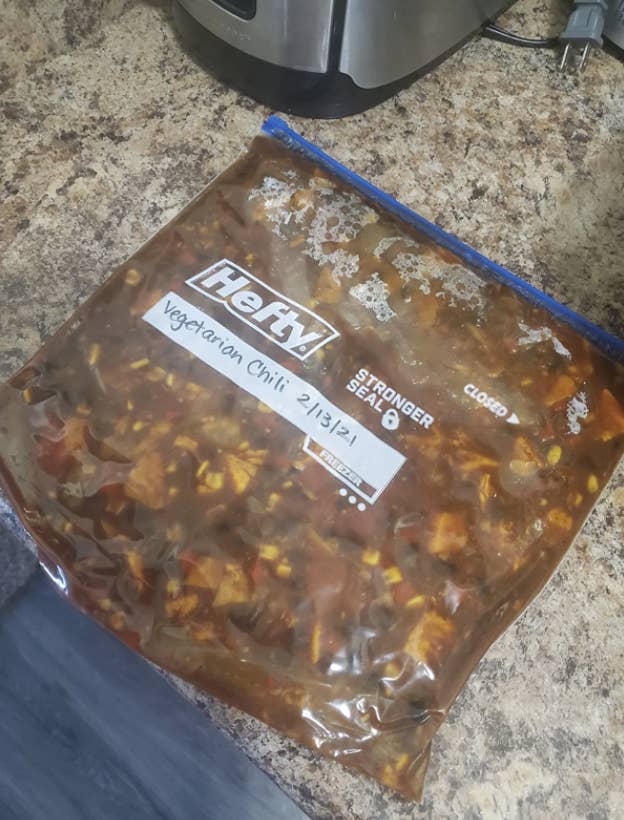 reviewer's pic of a ziplock bag with vegetarian chili stored in it