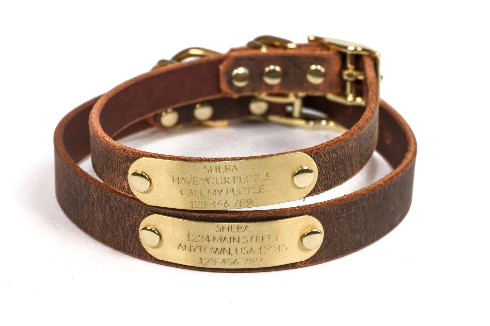 two of the brown leather dog collars with personalized nameplates