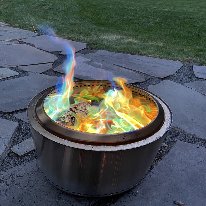 a reviewer's outdoor fire showing colorful flames