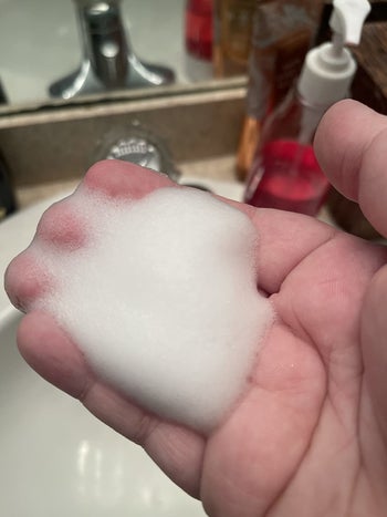 a different reviewer holding the foam in their hand