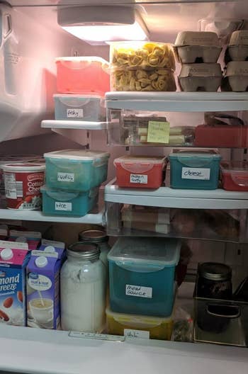 A reviewer shows their fridge full of with labeled items