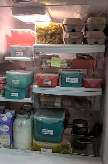 A reviewer shows their fridge full of with labeled items