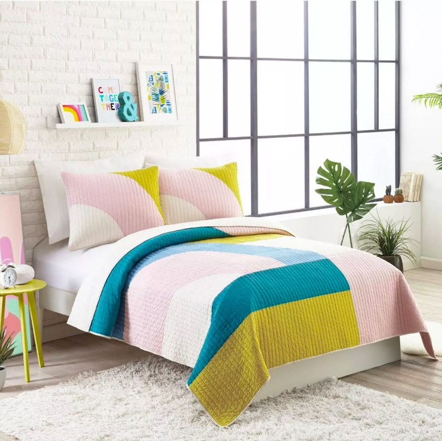 Quilt set in color &quot;Pink&quot; shown on a bed