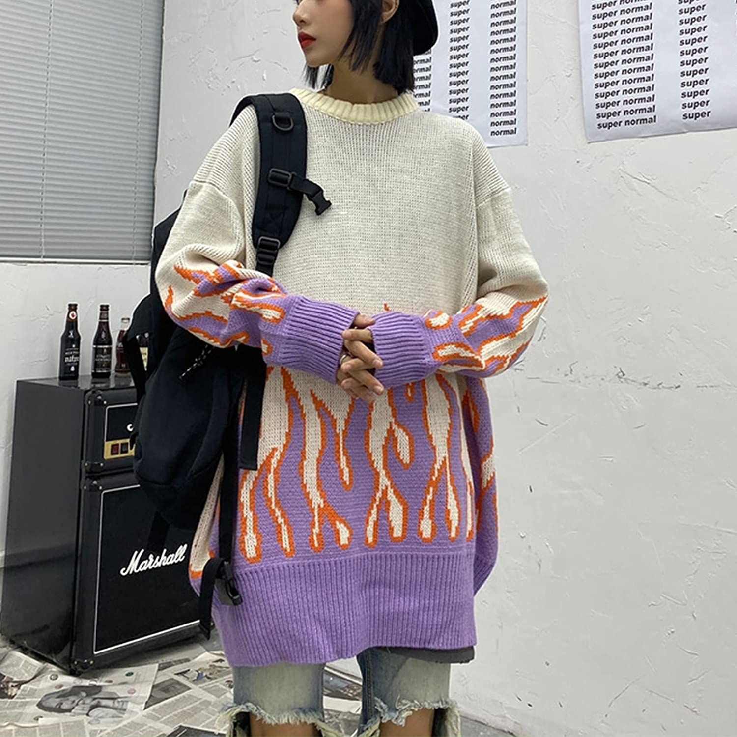 large sweater with purple flames on bottom and sleeves