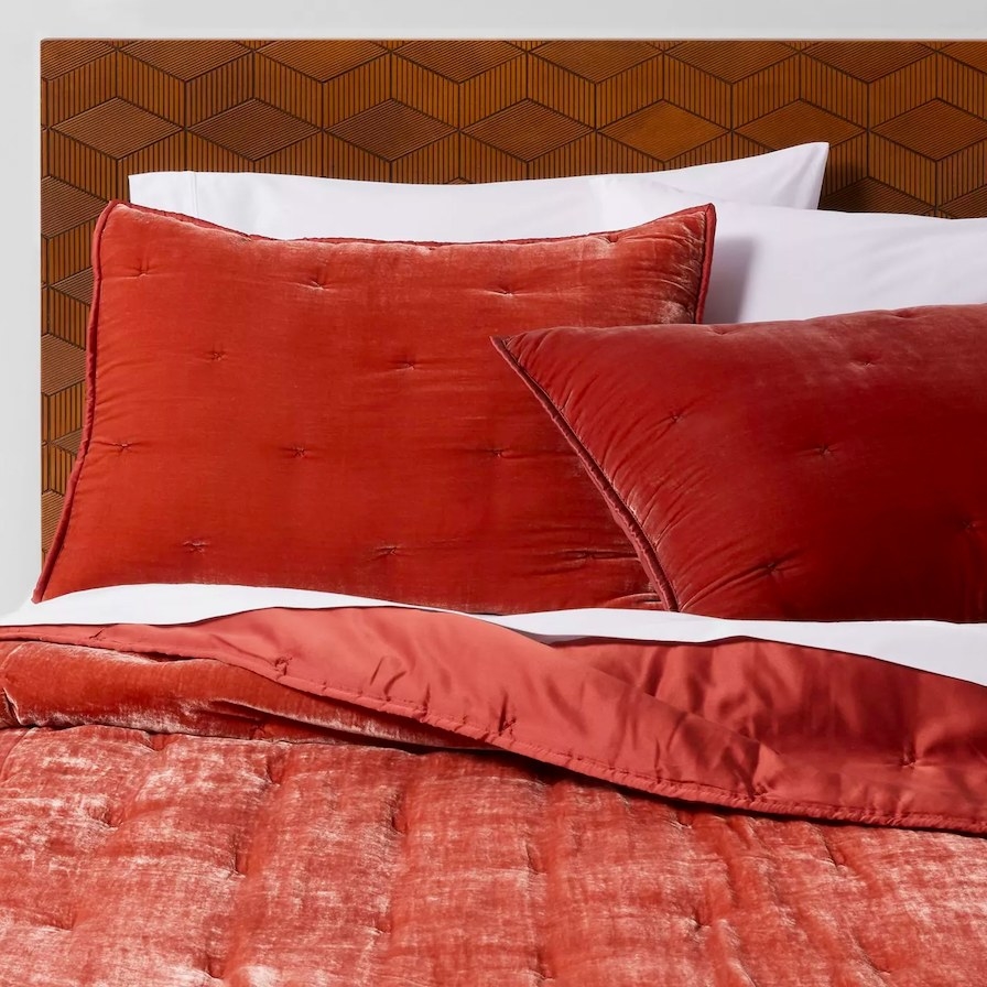 Velvet quilt shown on a bed