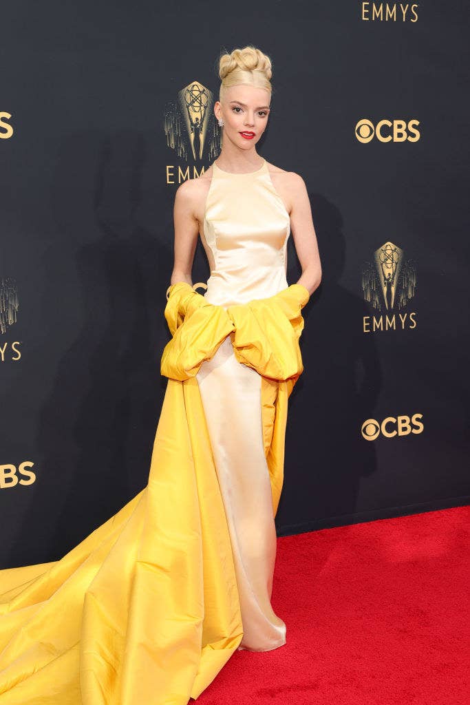 Anya at the 2021 Emmys red carpet, she wears a custom sunflower-yellow Dior dress with a halter neckline