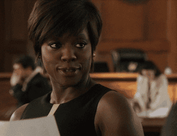 Annalise smirking in the courtroom