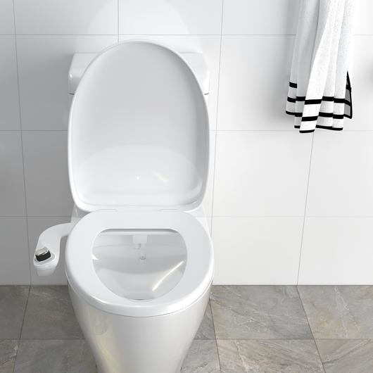 a toilet with the bio bidet attachment on it