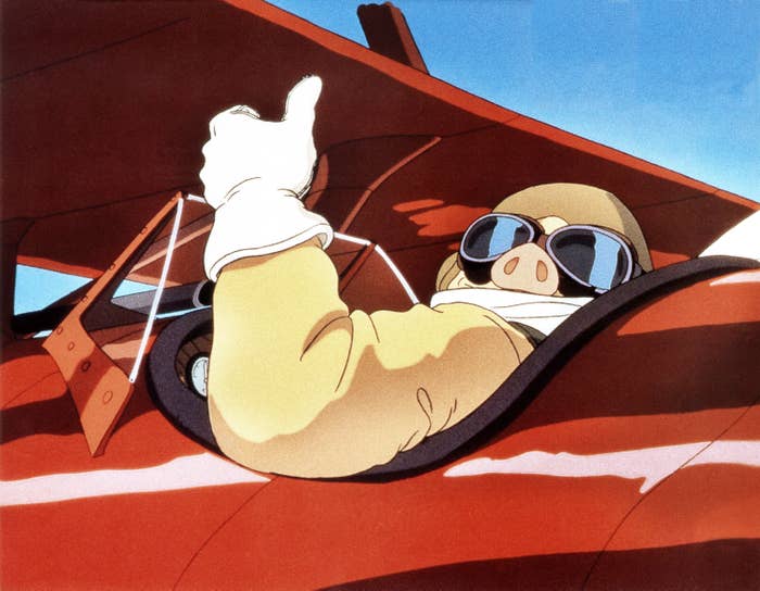 Porco from &quot;Porco Rosso&quot; giving a thumbs up un his red fighter plane