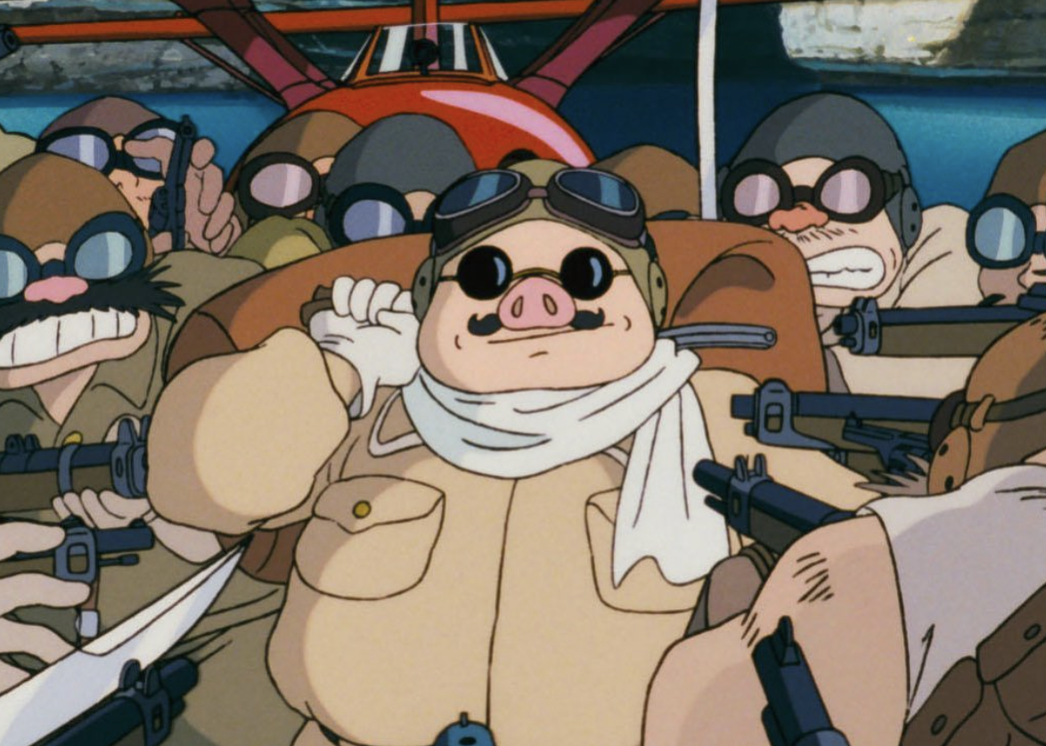 Porco smirking while he is surrounded by angry pirates as they point their weapons at him
