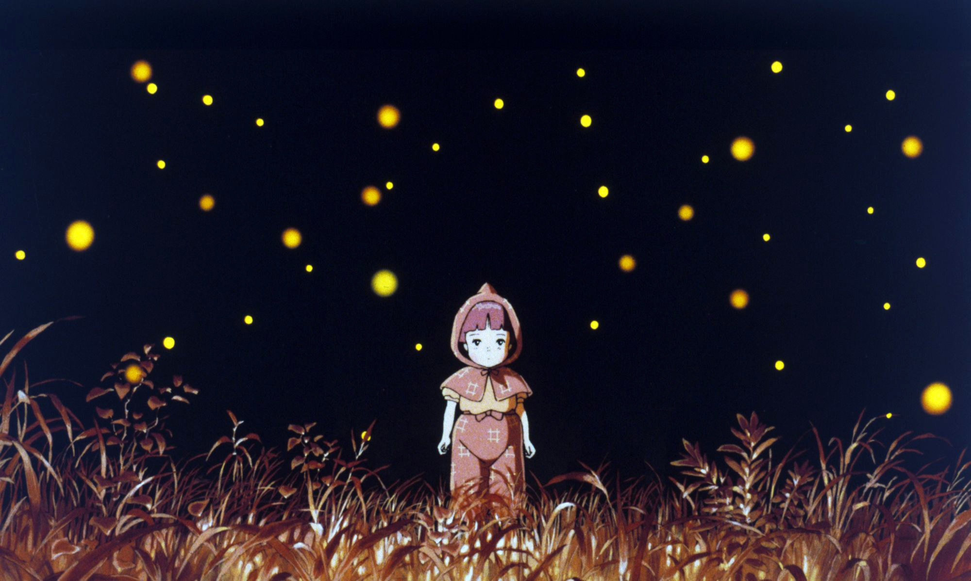 Setsuko standing in a field surrounded by fireflies