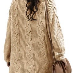 A model wearing the same oversized chunky knit cardigan in beige