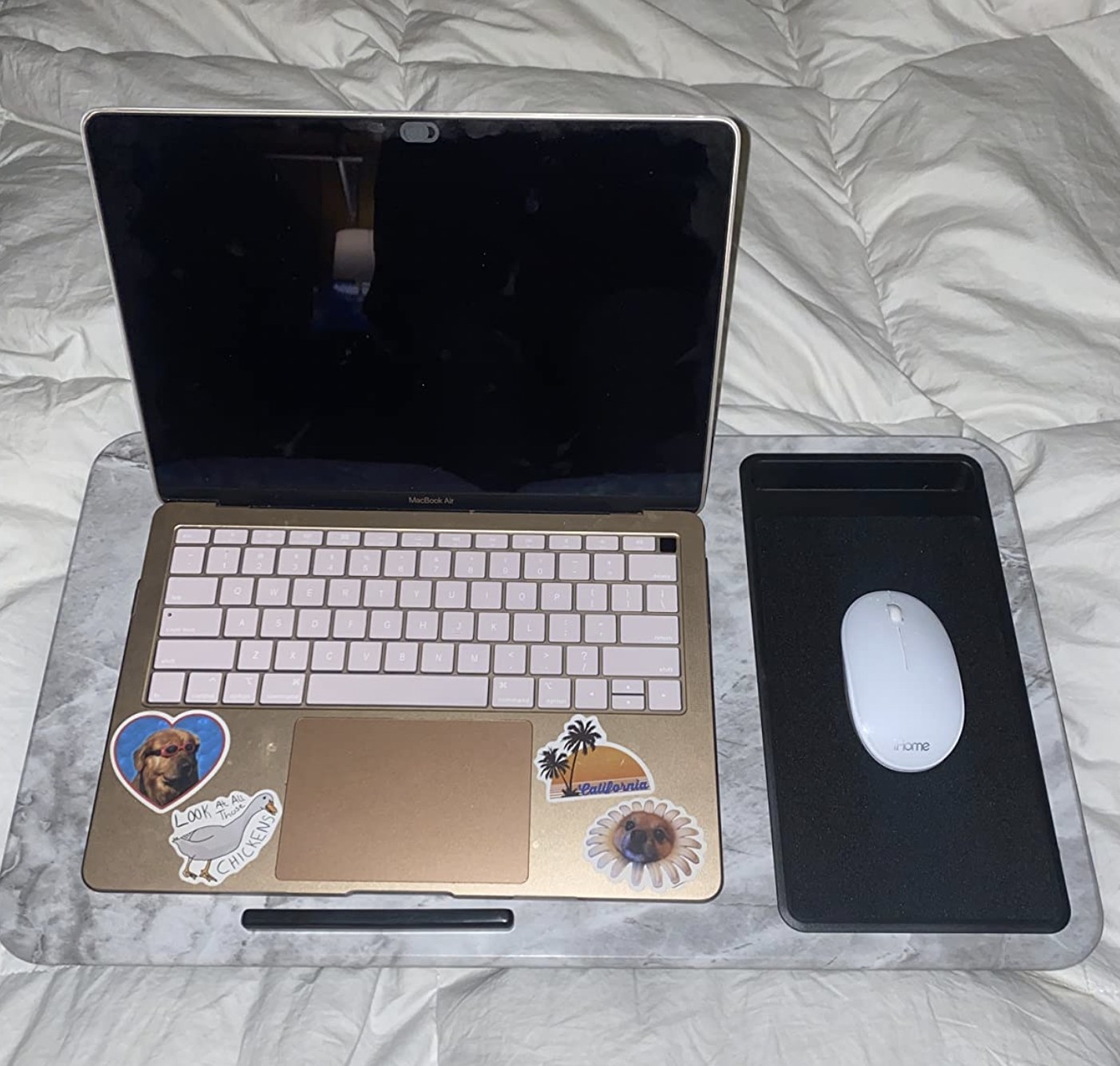 a reviewer photo of a laptop and a mouse on a lap desk
