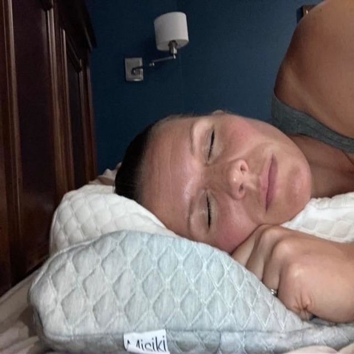 reviewer sleeping on their side on the pillow
