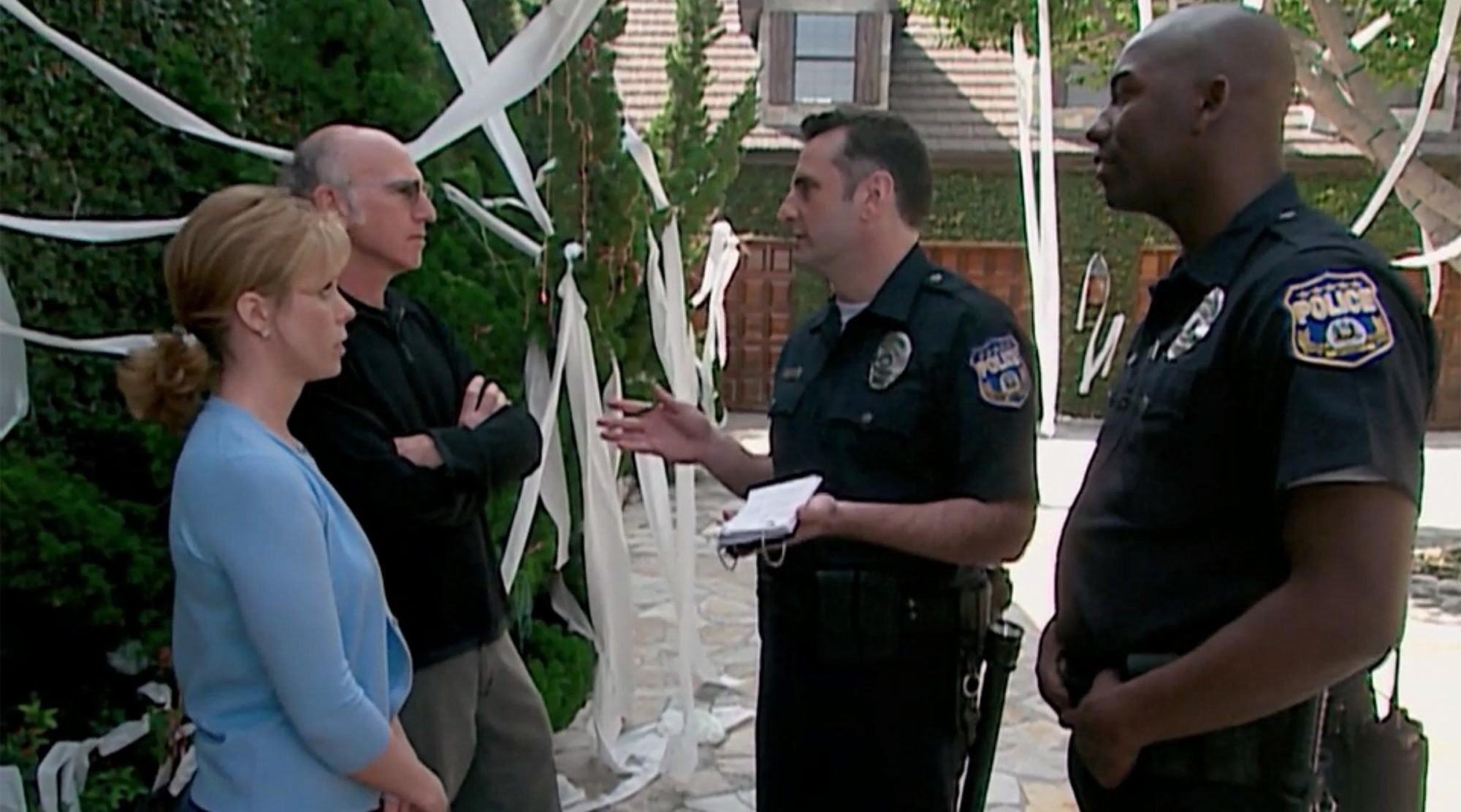 Cheryl and Larry talking to police officers