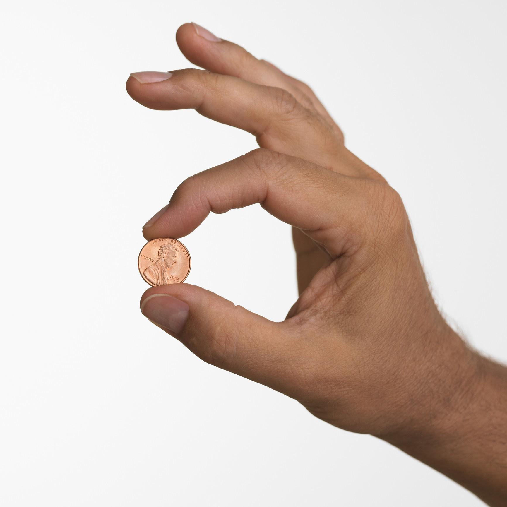 person holding a penny