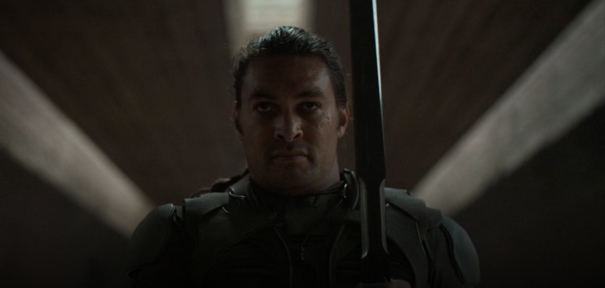 Duncan holding his sword in "Dune"