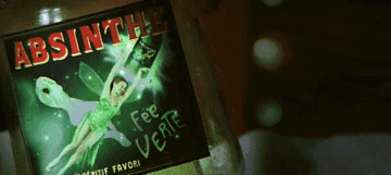 Christian hallucinating the green fairy from the absinthe bottle in Moulin Rouge