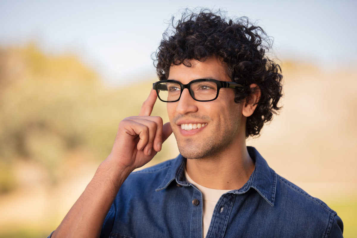 Smiling man wears Echo Frames glasses