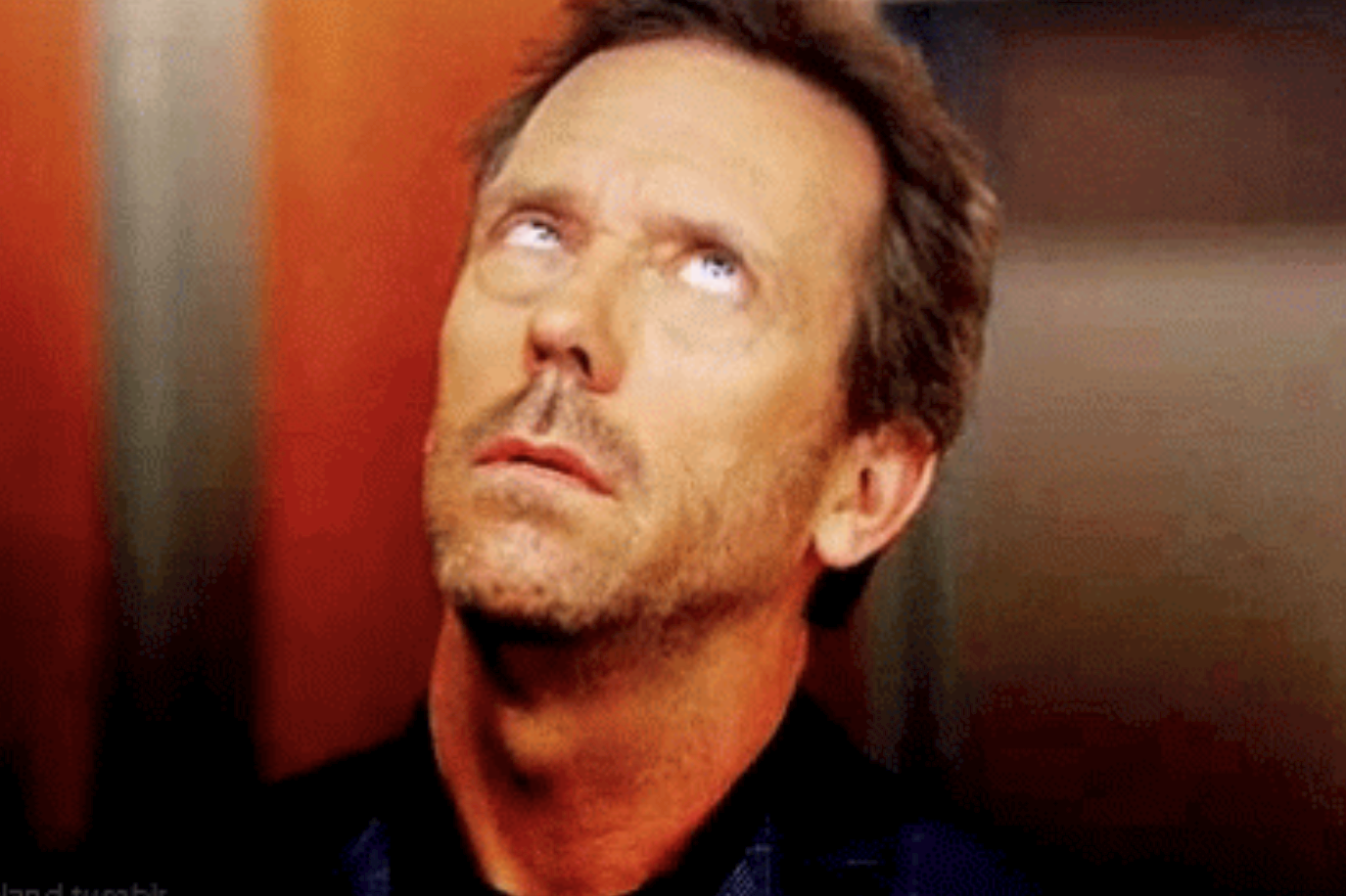 Hugh Laurie rolling his eyes