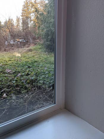 Reviewer photo of the same window caulk looking much cleaner