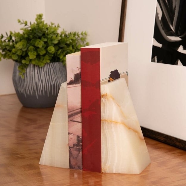 Marble bookends holding up two books