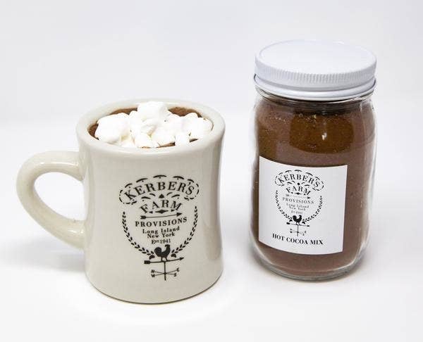 a kerber's farm mug and a jar of cocoa mix