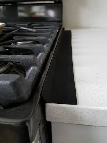 Reviewer photo of the gap cover between their stove and counter