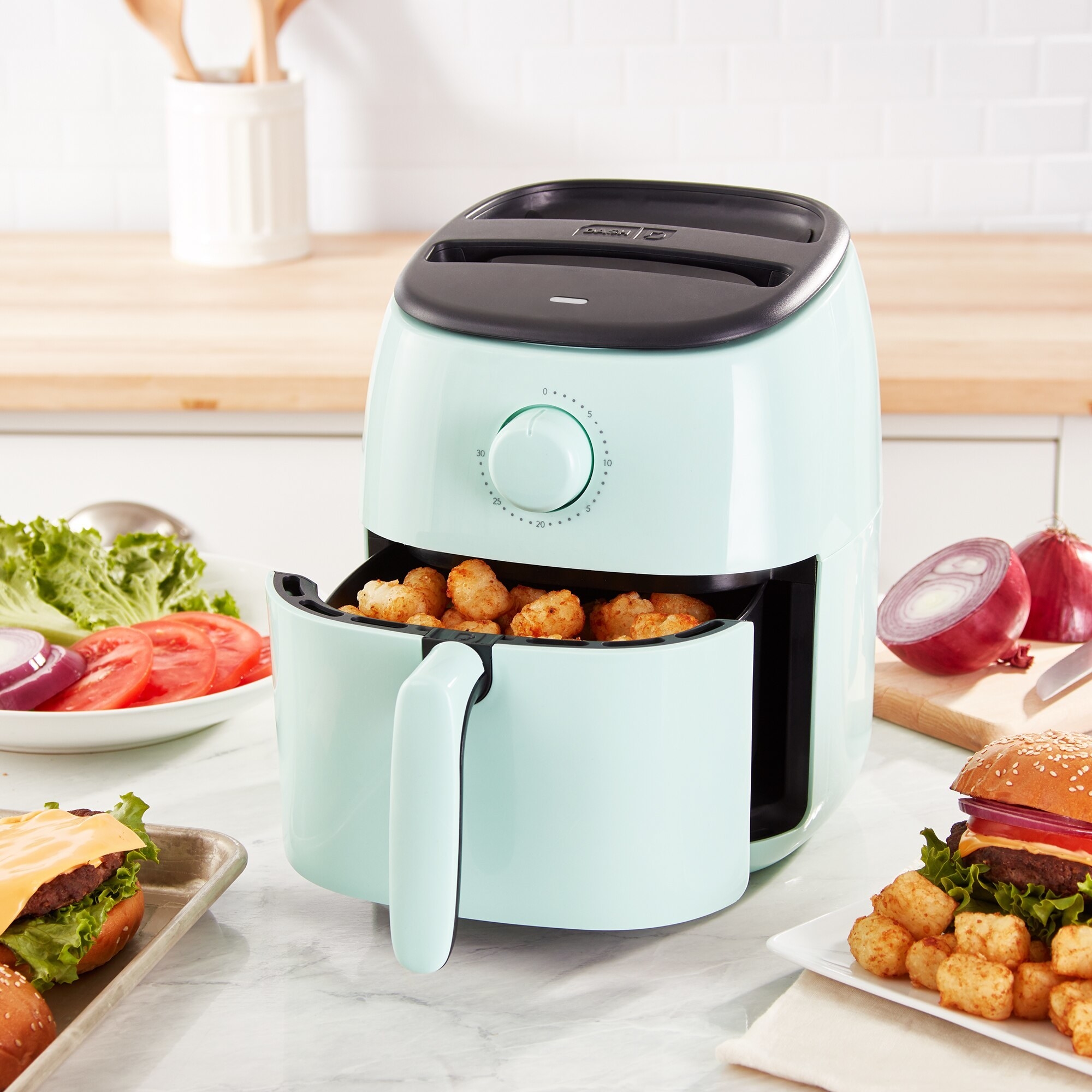 The air fryer filled with freshly-made fried cauliflower