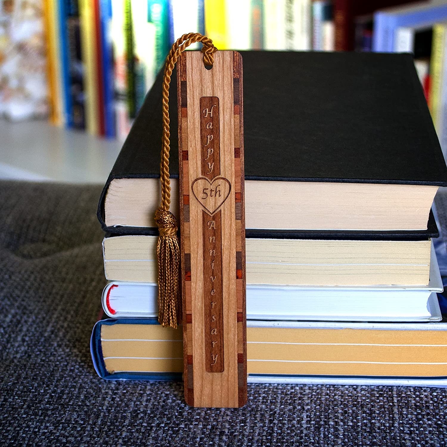 Image of the bookmark next to a stack of books