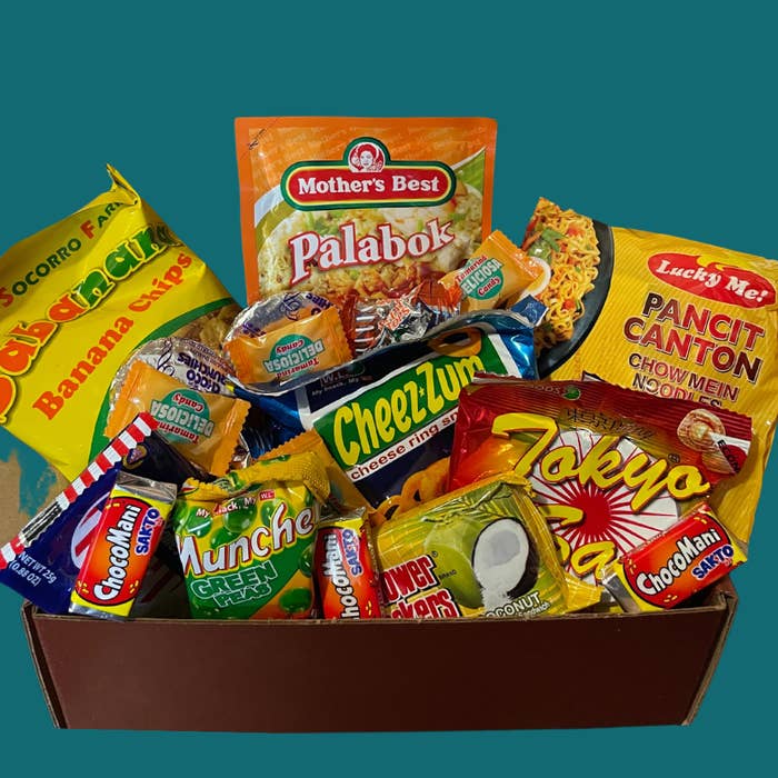 A large box filled with a variety of snacks