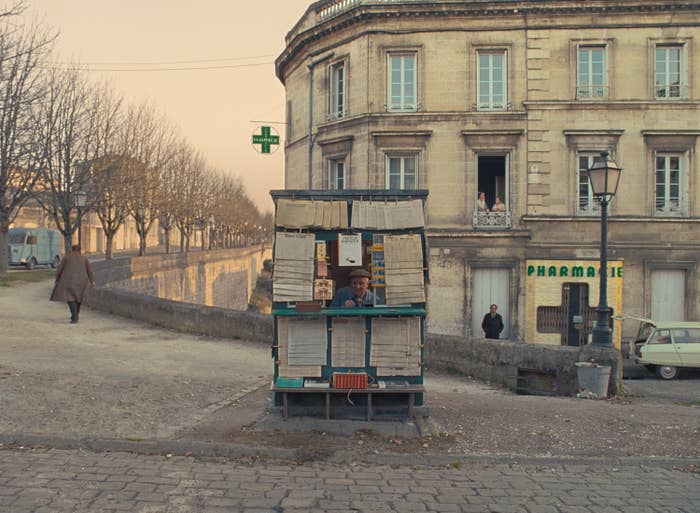 A man selling newspapers.