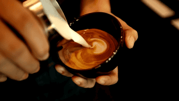 barista making latte foam art