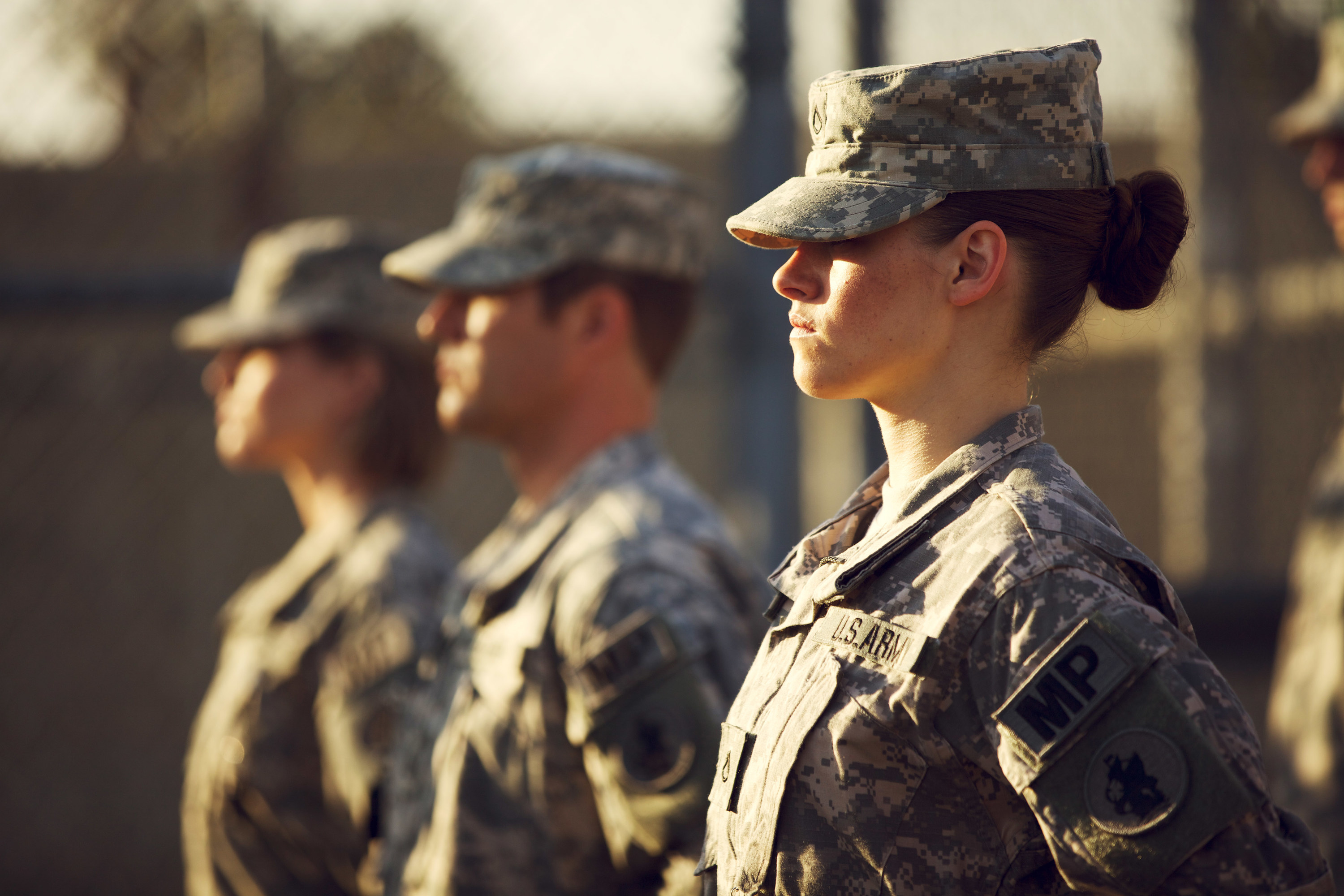 Kristen Stewart stands at alert in military fatigues