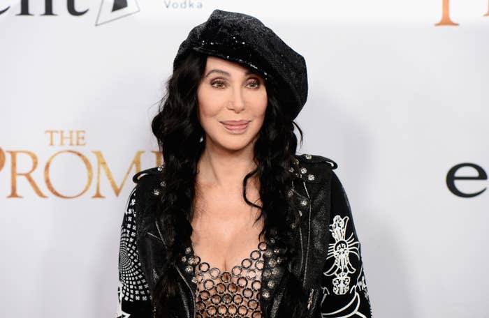 Cher smiles for a photo at a red carpet event