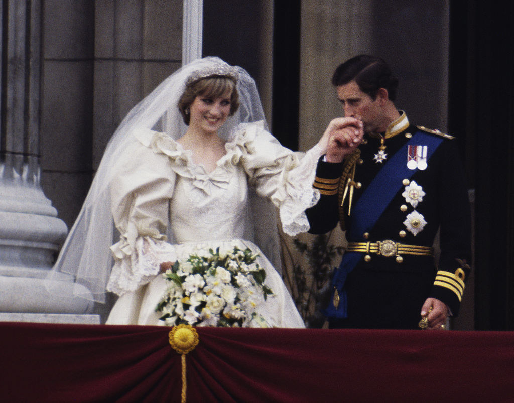 The Prince (R) and Princess of Wales on the balcony of Buckingham Palace on their wedding day
