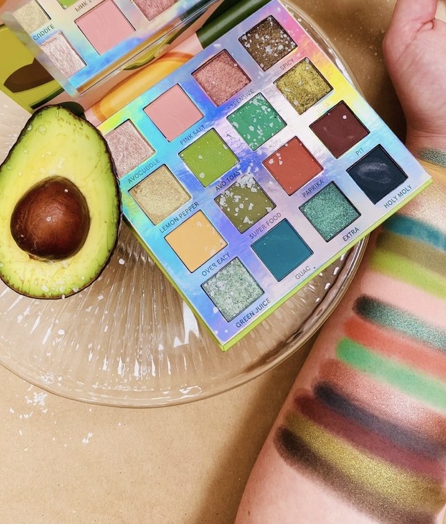 An eyeshadow palette and arm swatches