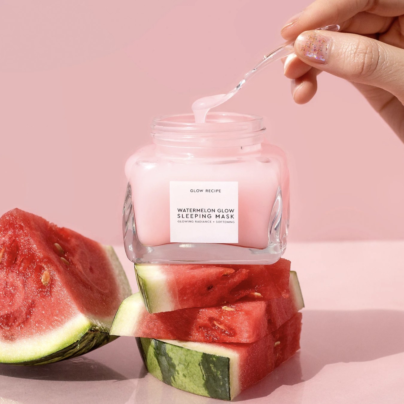 An open jar of a watermelon sleeping mask