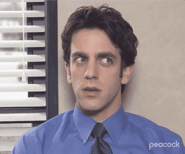 GIF of Ryan from The Office looking side-to-side