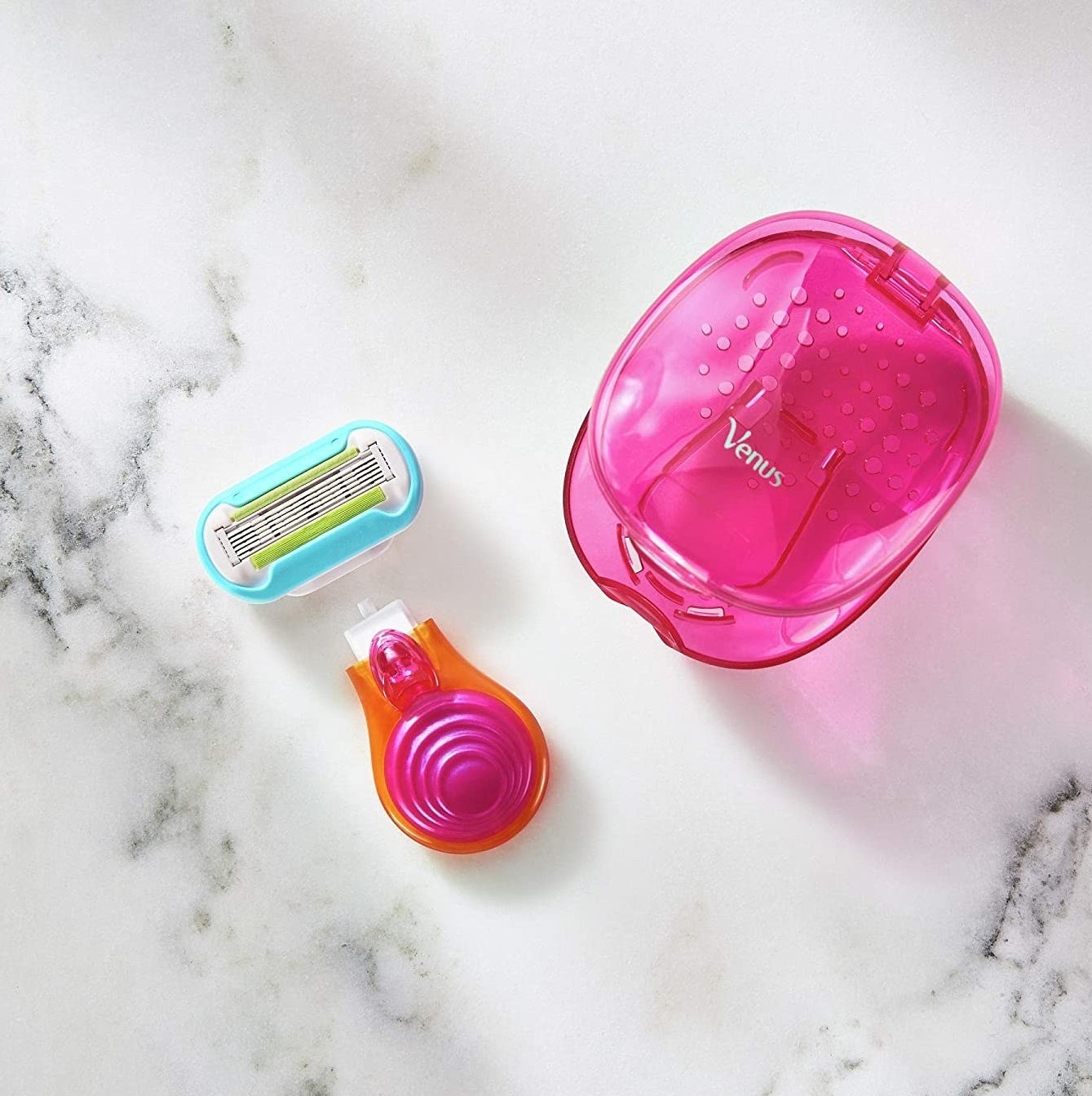 Venus travel-sized razor and container