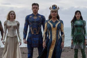 image of the cast from the eternals standing on the beach 