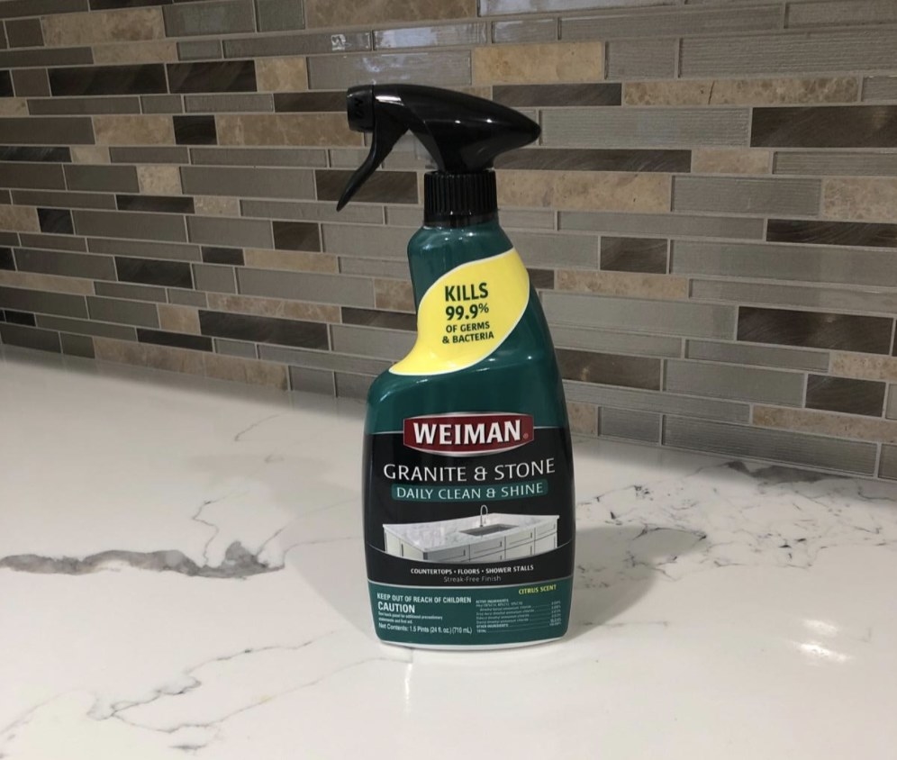 reviewer photo of the disinfectant spray on their kitchen countertop