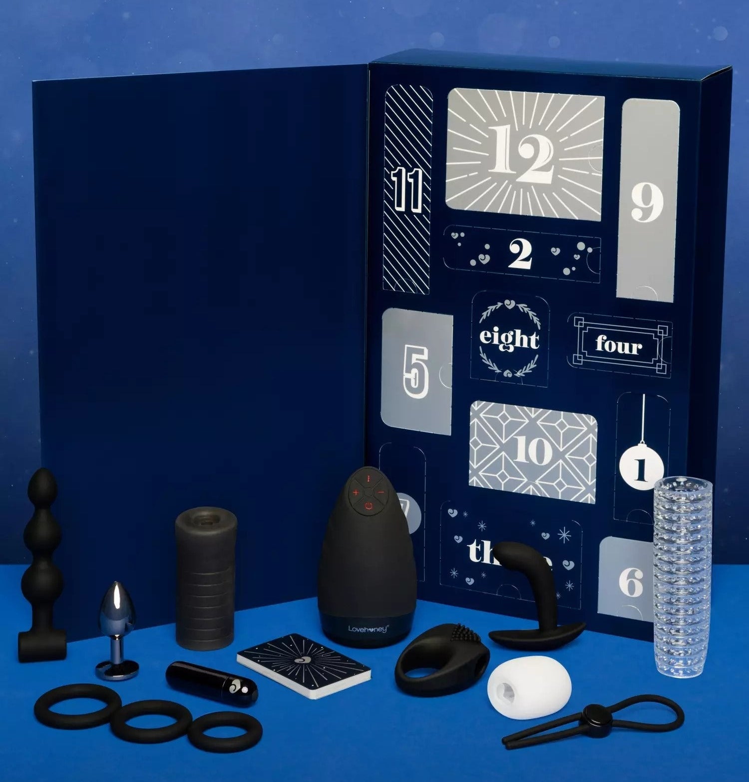 Blue advent calendar surrounded by black and white various sex toys
