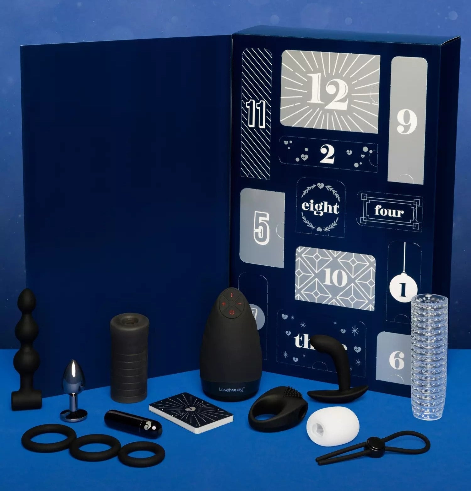 Blue advent calendar surrounded by black and white various sex toys