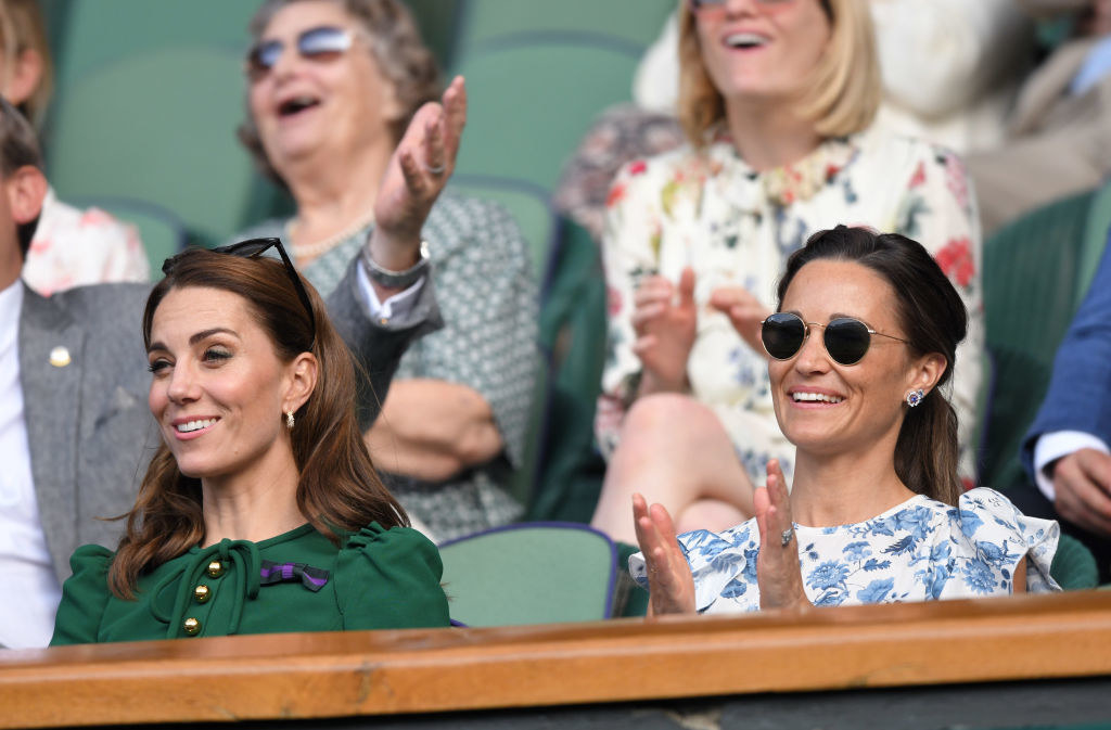 Kate and Pippa in the stands of a sports event