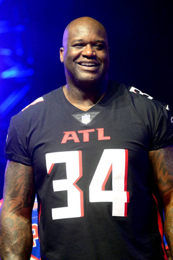 Shaquille O&#x27;neal wearing a jersey at an event.