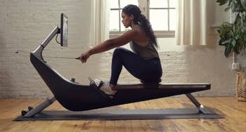 Product image of model working out on rowing machine